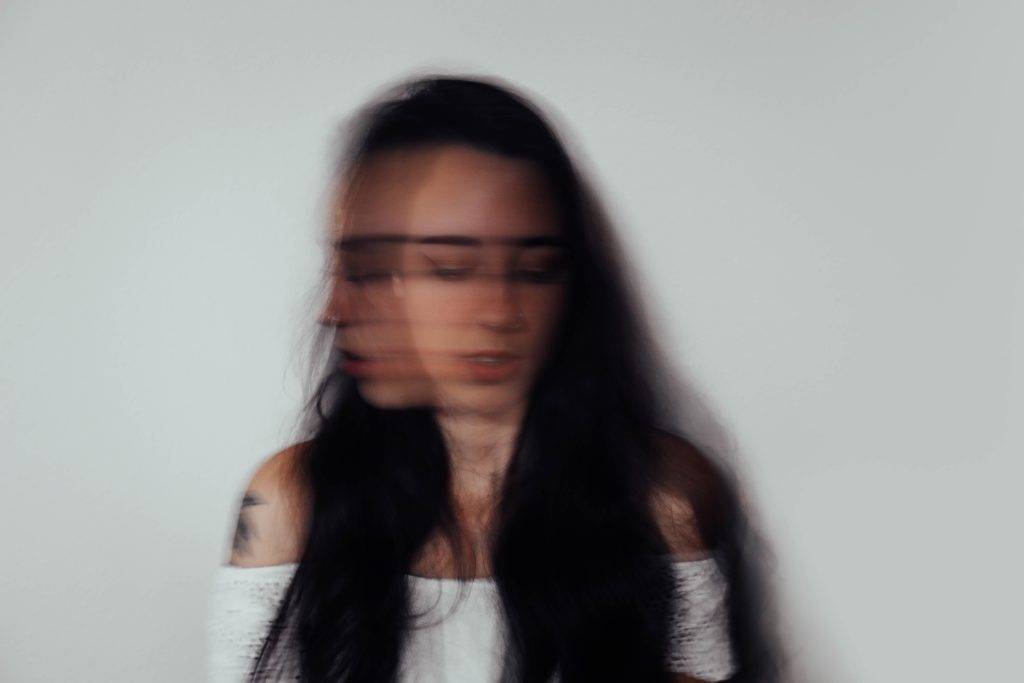 woman-blurred-face-brown-hair