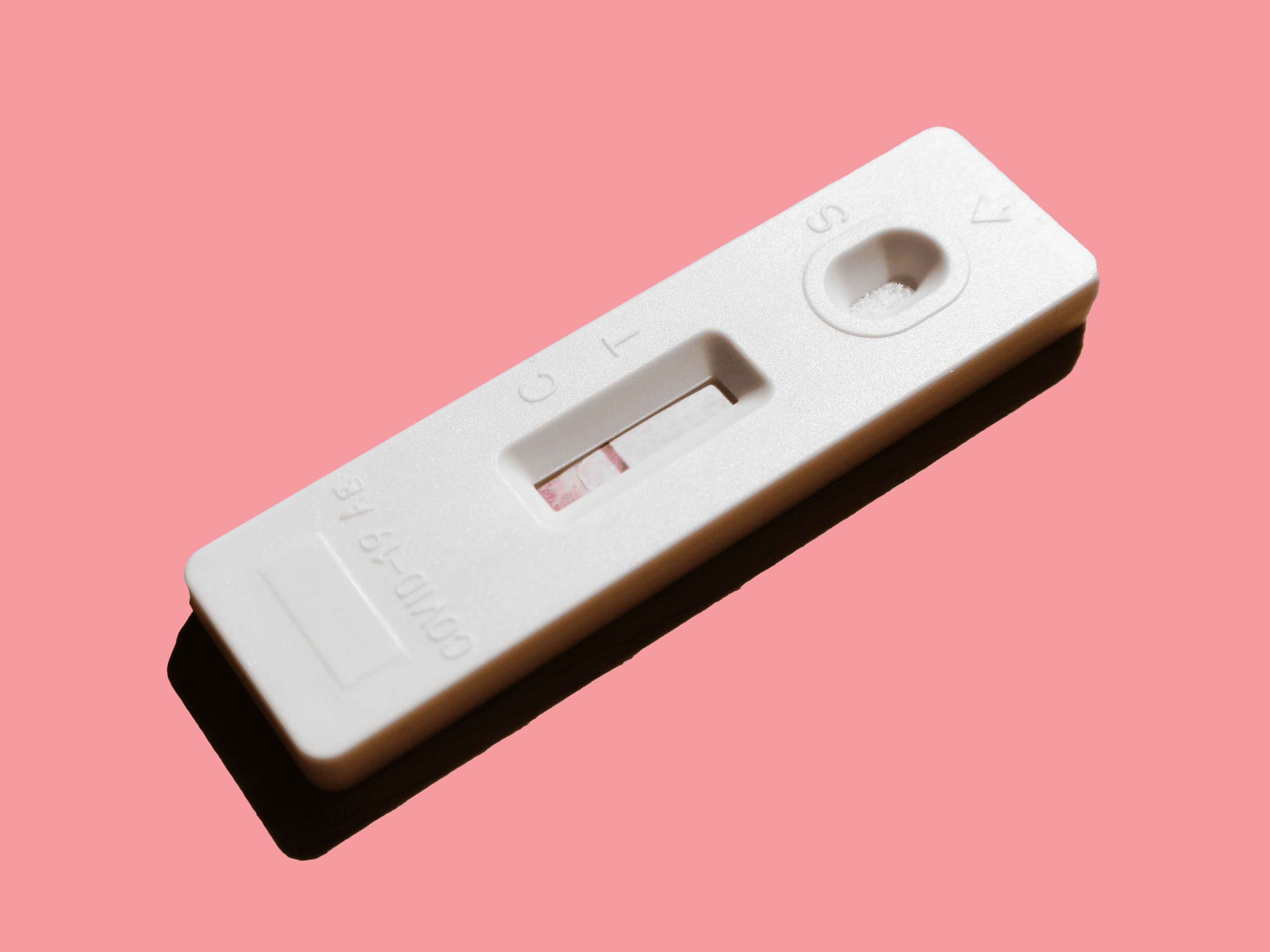 pink-background-pregnancy-test-one-line
